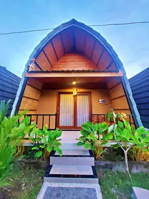 a house with a pathway leading to the front door at Yogasari Villa Seminyak in Seminyak