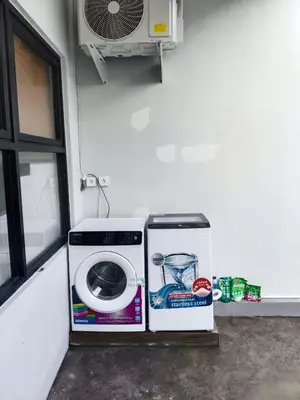 a washing machine is sitting next to a window at Peaceful Private 4 BR YY Bali Villa, Jimbaran Nusa Dua, In Central Kuta in Jimbaran