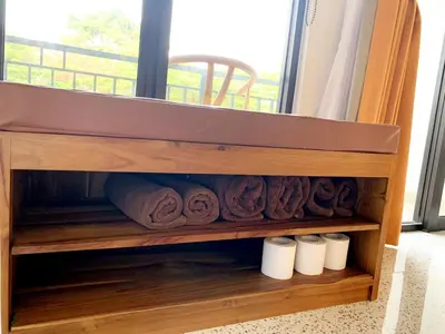 a shelf with rolls of toilet paper in a window at Peaceful Private 4 BR YY Bali Villa, Jimbaran Nusa Dua, In Central Kuta in Jimbaran