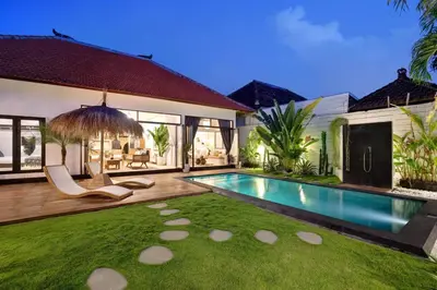 a backyard with a swimming pool and a house at 3 Bedrooms Luxury Umalas with private pool in Kerobokan