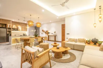 a living room with a couch and a table at Brand New 4br Villa 400 to Finns Canggu in Canggu