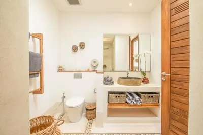 a bathroom with a sink and a mirror at Brand New 4br Villa 400 to Finns Canggu in Canggu