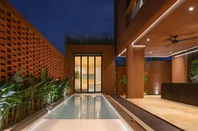 an indoor swimming pool in a house at Kula Terra One Bedroom Villa in Kerobokan