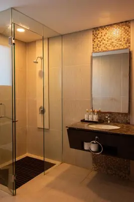 a bathroom with a sink and a shower at Bali Ula Villa in Nusa Dua