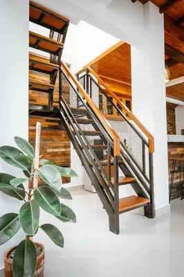 a staircase in a house with a potted plant at Villa Umah Seminyak in Seminyak