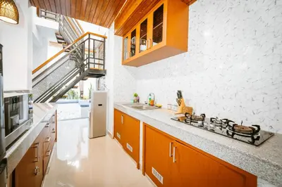 a kitchen with a sink and a stove at Villa Umah Seminyak in Seminyak