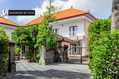 a house with an orange roof at Collection O Near Seminyak Beach Formerly The Kumpi Hotel in Seminyak