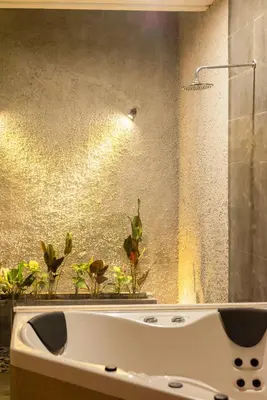 a bathroom with a sink with plants in it at Bali Stile villa in Nusa Dua