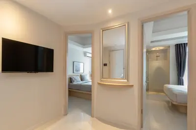 a living room with a flat screen tv on a wall at Bustle Base Coliving and Coworking Space in Legian