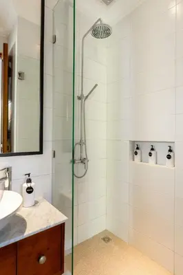 a bathroom with a shower with a glass door at Paradise in the heart of Seminyak, 1-BR Pool-Villa in Seminyak