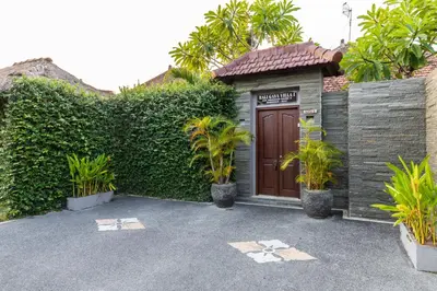 a house with a brown door and some plants at 2 Bedroom Villa with Pool Seminyak with Car Park in Seminyak
