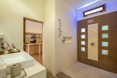 a bathroom with a tub and a shower stall at Cozy 2 Bedroom Villa in Seminyak with private Pool in Seminyak
