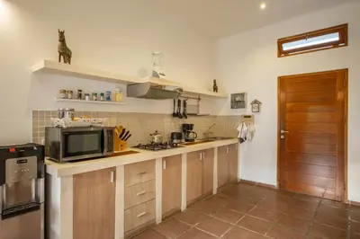 a kitchen with a microwave and a counter top at Cozy 2 Bedroom Villa in Seminyak with private Pool in Seminyak
