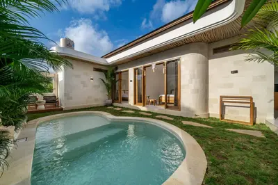 a swimming pool in the backyard of a house at Nooky 2 - PROMO Seminyak - 2 BDR - Brand NEW Villa - HUGE Pool in Kerobokan