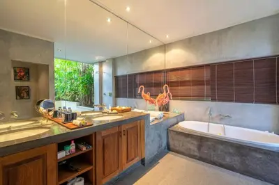 a bathroom with two sinks and a bath tub at 4BR Villa with Large Pool at Seminyak Beach in Seminyak