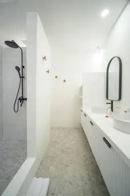 a white bathroom with a sink and a mirror at Casa Solace - New! Sparkling villa in the heart of Berawa or Canggu in Canggu