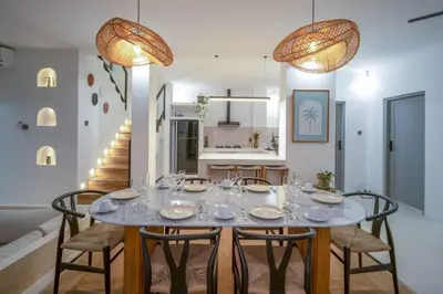 a dining room with a table and chairs at Casa Solace - New! Sparkling villa in the heart of Berawa or Canggu in Canggu