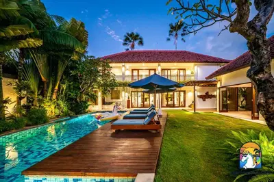 a home with a swimming pool and a house at Villa Kajou - by Unicorn Villas Bali in Seminyak