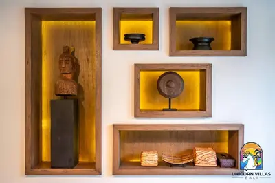a wall with four different types of vases and other items at Villa Kajou - by Unicorn Villas Bali in Seminyak