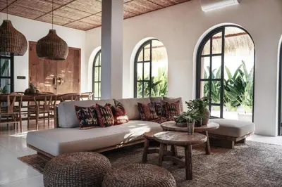 a living room with a couch and a table at Villa Almaz Seminyak in Seminyak