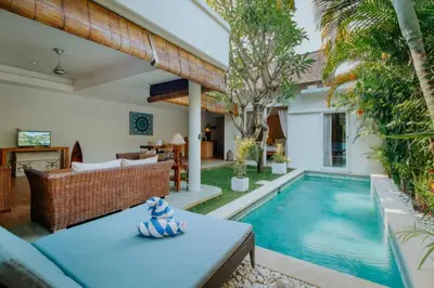 a patio with a swimming pool and a villa at Cozy & Private 1 Bed Pool Villa in Trendy Umalas in Kerobokan