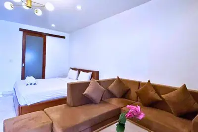 a living room with a couch and a bed at Reline 1 BR Studio with Sofa Bed in Jimbaran