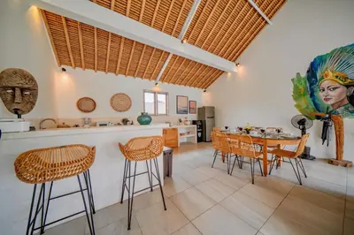 a kitchen and dining room with a table and chairs at Villa Antea in Seminyak