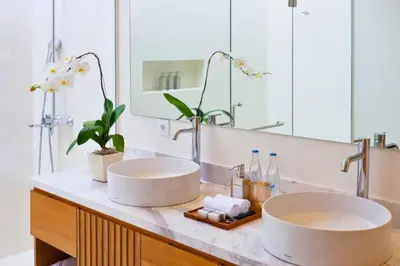 two sinks on a counter in a bathroom at Nawasena 5 BR Private Pool Villa in Canggu