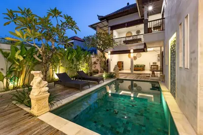 a swimming pool in the backyard of a house at Villa Raja Seminyak by KING in Seminyak
