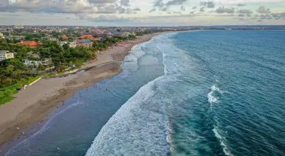 an aerial view of a beach and the ocean at The Aroma's of Bali Hotel & Residence in Legian