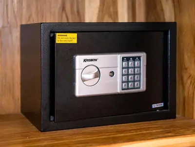 a microwave oven with a remote control on a table at Villa Shantika by Villa Finder in Seminyak
