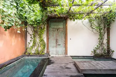 an entrance to a house with a door at Villa Pisces - 2 Bedrooms Villa with Private Pool at Kerobokan in Denpasar