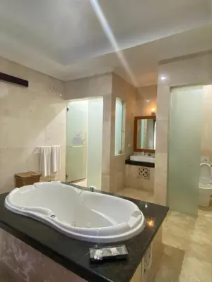 a large bathroom with a large tub on a counter at One Bedroom Private Pool Classic Villa in Kuta