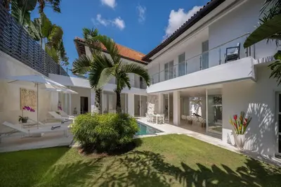 an exterior view of a villa with a swimming pool at Villa Manis Cantik in Seminyak