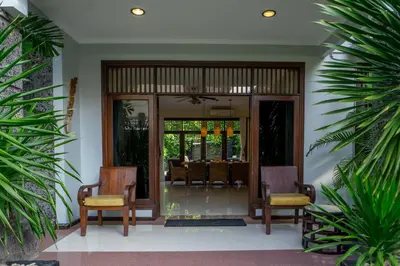 a lobby with two chairs and a table at Atres Griya Villa 5 Private Bedroom Kuta in Kuta