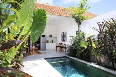 a courtyard with a swimming pool in a villa at Villa Nook in Seminyak