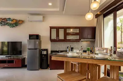 a kitchen with a refrigerator and a counter top at 2 Bedroom private Pool Seminyak in Seminyak