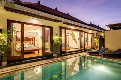 a villa with a swimming pool and a bedroom at 2 Bedroom private Pool Seminyak in Seminyak