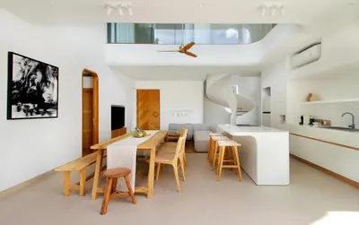 a kitchen and dining room with a table and chairs at Jipsi Villas Canggu in Canggu