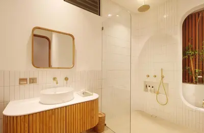 a bathroom with a sink and a mirror and a shower at Jipsi Villas Canggu in Canggu