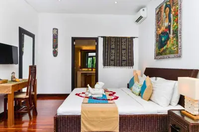 a living room with a couch and a table at Chandani 3 BR Private Pool Villa in Ujung