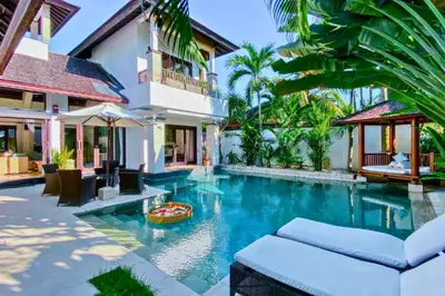 a swimming pool in the backyard of a villa at Charvi 1 BR Private Pool Villa in Ujung
