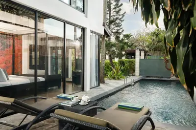 a swimming pool in the backyard of a house at Shanti Estate Seminyak by Nakula in Seminyak