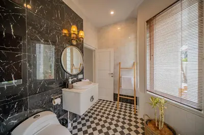 a bathroom with a sink and a mirror at Deja Blu Villa in Seminyak