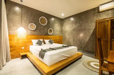 a bedroom with a large bed in a room at Minimalist Villa with Pool #Nico1 in Canggu