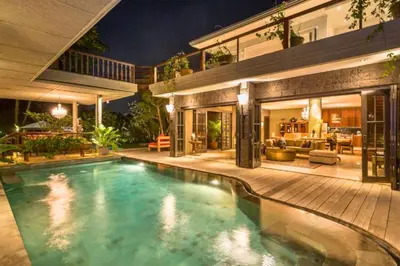 a swimming pool in the backyard of a house at Janya 3 BR Private Pool Villa ZN158 in Canggu