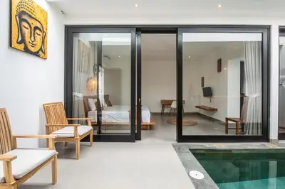 a living room with a tub and a bedroom at Minimalist Villa with Pool #Lina2 in Canggu