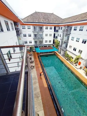 an overhead view of a swimming pool in a apartment building at Harris Hotel & Residences Kuta in Kuta