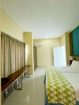 a hotel room with a bed and a window at 3 Bedroom Calla Villa in Nusa Dua
