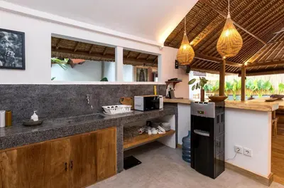 a kitchen with a sink and a counter top at Villa Waterlily by Villa Finder in Seminyak
